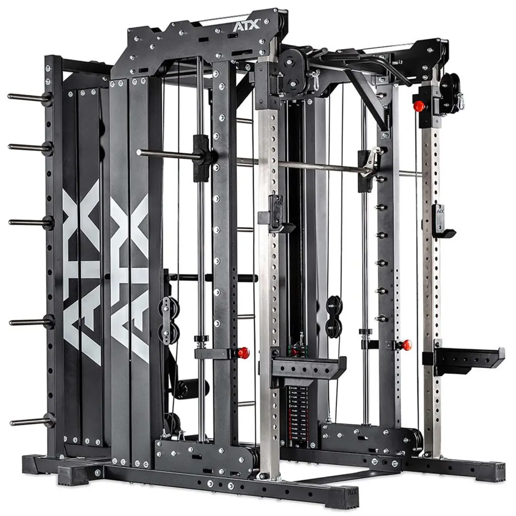 A multi-functional gym machine featuring a squat rack, smith machine, and cable system. The structure is black with metallic components, and it includes weight storage pegs and adjustable pulleys. The brand logo ATX is visible.