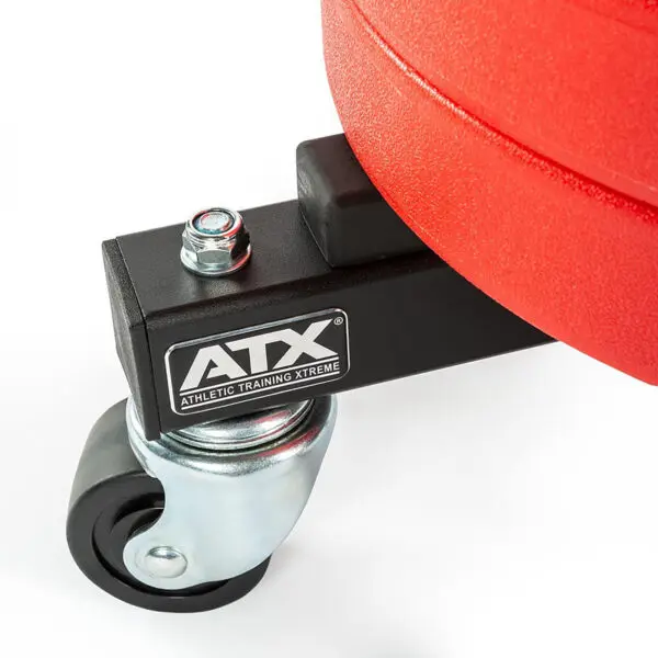 Close-up of a red weight plate on the black ATX® Rolling Bumper Stacker, featuring a metal swivel caster wheel underneath.