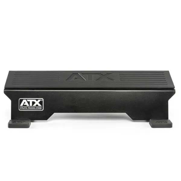 The ATX® Calf Block is a black athletic training step with a grooved surface and small rectangular feet, ideal for fitness routines. The ATX logo is on the side and top. It doubles as a calf block, perfect for targeted exercises and enhanced workouts.