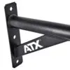 Close-up of a black metal ATX® Chin Up Bar Wall Mounted, showing a triangular support and white ATX letters. The bar is fixed to a flat vertical surface with bolt holes for mounting.