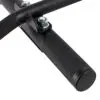 Close-up of the ATX® Chin Up Bar Wall Mounted with textured black metal grips and two shiny metallic bolts, showcasing a sleek, sturdy design ideal for fitness equipment or machinery.