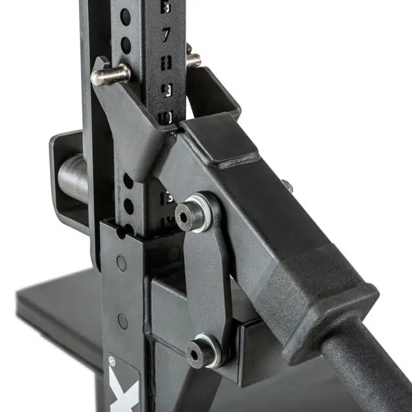 Close-up of the ATX® Competition Combo Rack, a black adjustable weightlifting rack with numbered height settings and secure locking mechanisms. Its sturdy design features a base and metal pegs for securing the barbell.