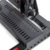 Close-up of the ATX® Competition Combo Racks metal component, showcasing a perforated step plate secured with bolts. It features sturdy construction with rectangular cutouts for grip and ventilation. The dark gray metal includes a small red tag at the bottom left.
