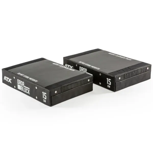 Two ATX® 15 cm Soft Drop Blocks are shown side by side. Theyre rectangular and black with white text reading ATX DROP BLOCK and MAX WEIGHT 300KG, designed for weightlifting or fitness use.