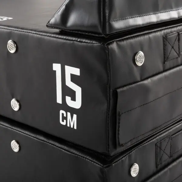 Close-up of ATX® 15 cm Soft Drop Blocks stacked, featuring a white 15 cm label for thickness, reinforced corners, and metal rivets for durability.