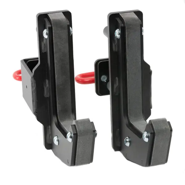 The ATX® J-Hooks Type III feature a black metal design for power racks, red safety pins, and padded interiors to protect barbells. The upright position highlights their robust and solid construction.