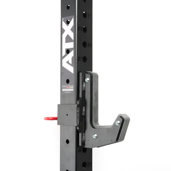 Close-up of a black metal rack with adjustable height holes, showcasing an ATX® J-Hooks Type III securely attached. A red pull pin is visible, and ATX is printed vertically on the side.