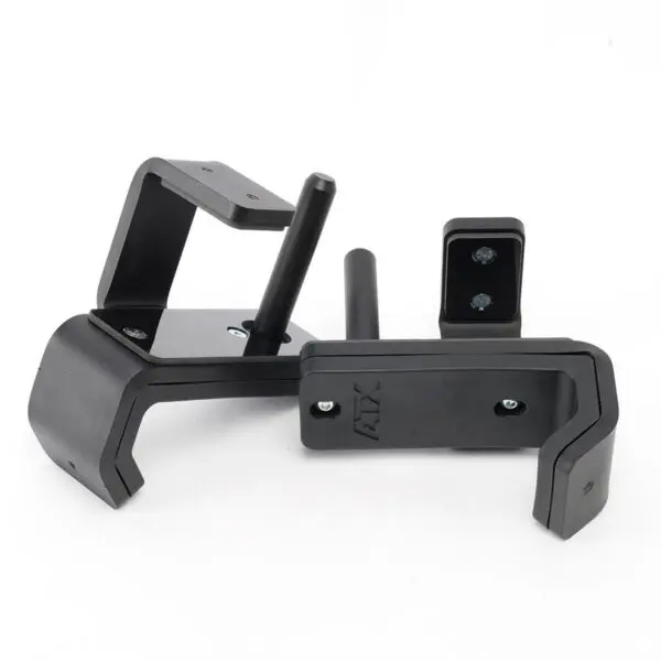 The ATX® J Hooks Compact are black, wall-mounted squat rack hooks with mounting holes and cylindrical pegs for securely holding weightlifting bars. They feature a durable metal construction with a matte finish.