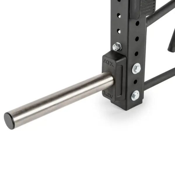 A close-up shows an ATX® Jammer Arms attachment, with a long metal bar extending horizontally and secured by bolts on a black, perforated frame with branding. The setup appears sturdy and industrial.
