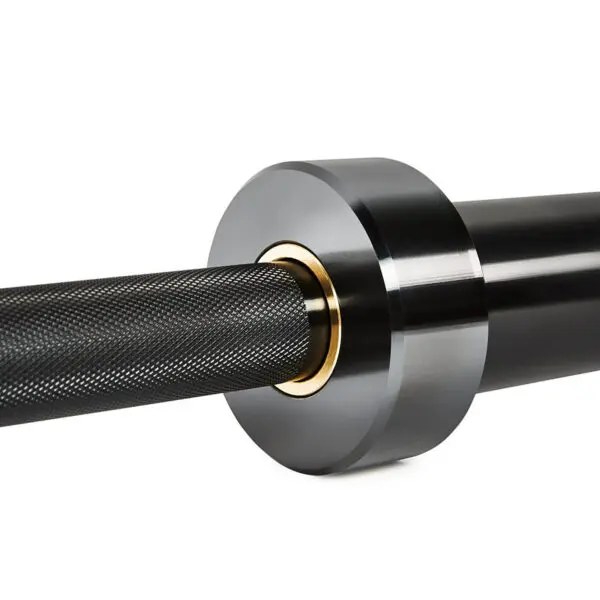 Close-up of an ATX® Olympic Black Mamba Power Bar with a textured grip and gold accents. The barbells end showcases a smooth, rounded weight collar, highlighting the sleek and modern design of this fitness equipment.
