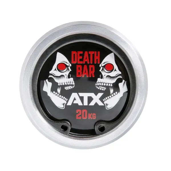 Close-up of a barbell end cap marked Death Bar and ATX with stylized skulls featuring red eyes, 20 KG, and a metallic finish on the ATX® Olympic Power Barbell - Black.