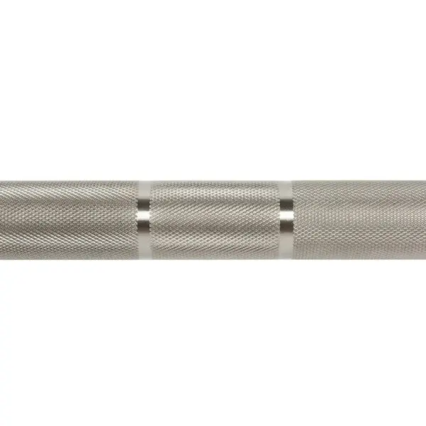 A close-up of the ATX® Olympic Stainless Steel Bar shows its textured knurled grip with a smooth ring pattern. The shiny, reflective surface highlights the precision of its engraving.