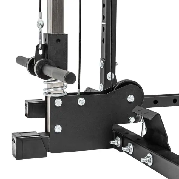 Close-up of the ATX® Lat Option 520 215cm, a gym machine featuring a heavy-duty pulley system with metal rods, cables, and bolts. Its black structure with silver accents highlights robust construction and multiple adjustable components for exercise use.
