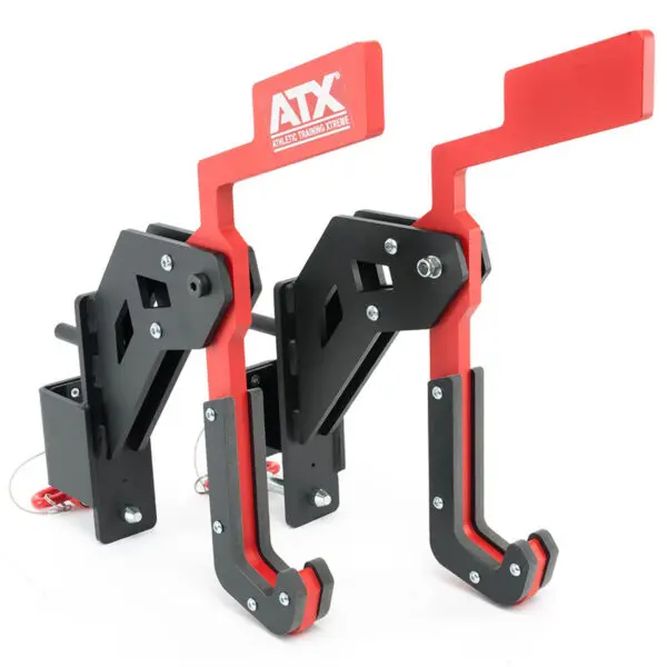 A pair of ATX® Mono Lift red and black tines for lifting or rigging exercises, featuring sturdy construction with hooks and adjustable components for secure attachment. Visible branding on the top part of the tines.