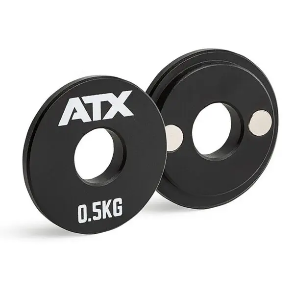 A pair of sleek, black ATX® Magnetic 0.5kg single weights featuring ATX and 0.5KG printed on them, each with a circular cutout in the center.