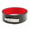The ATX® Lever Leather Powerlifting Belt is designed with a black leather exterior, a red interior, and a silver buckle that features the engraved ATX logo.