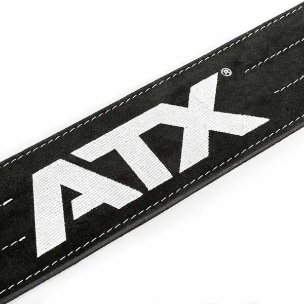 Close-up of the ATX® Suede Power Belt in black, showcasing bold white ATX lettering and visible white edge stitching.