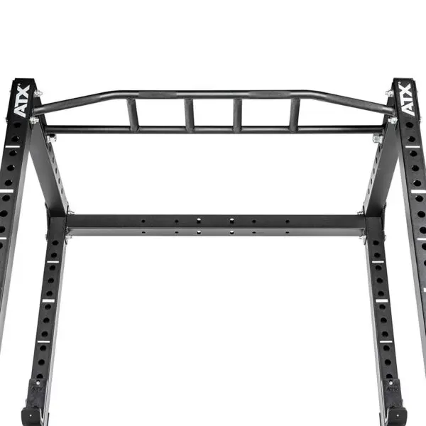 The image features a detailed view of the ATX® Power Rack 610 195cm for Low Ceilings, showcasing a black metal pull-up bar with multiple grip variations and perforated vertical supports.