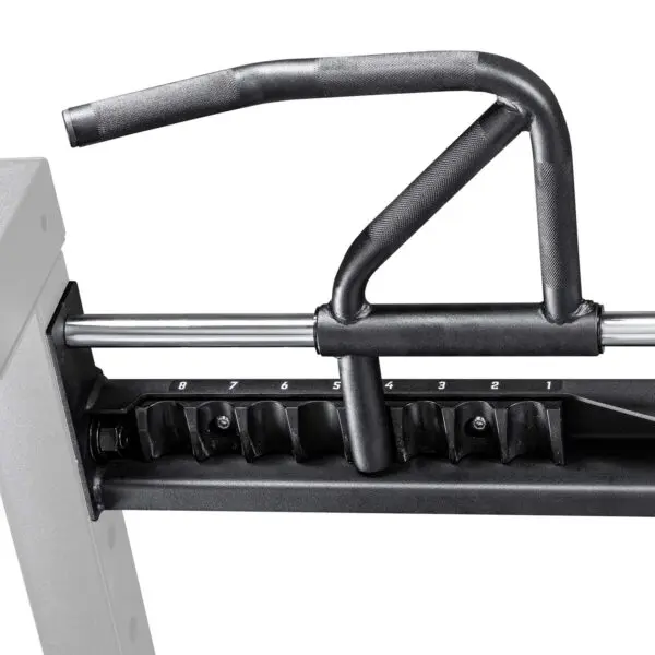 Close-up of the ATX® 750 Indexing Chin Up with a black multi-grip pull-up bar attachment on a metal frame, featuring adjustable numbered settings. The sleek, industrial design suggests it’s for weight training exercises.