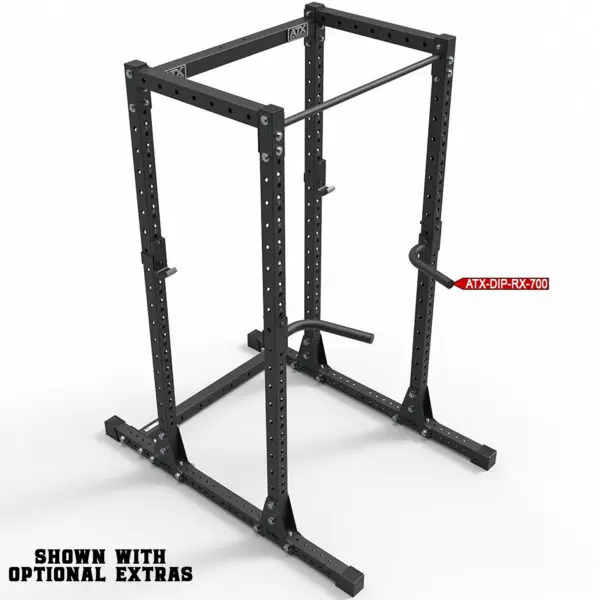 The ATX® Commercial Power Rack 750 is a black power rack with adjustable parts and a dip bar attachment, ideal for weightlifting. The frame is robust, and text on the bottom left notes: Shown with optional extras.