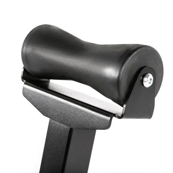 A close-up of the ATX® Landmine Barbell Stand reveals a black, cylindrical foam roller attached to a metal bracket for resistance or rowing exercises. The roller is mounted on a sturdy steel frame designed for comfort and support during workouts.