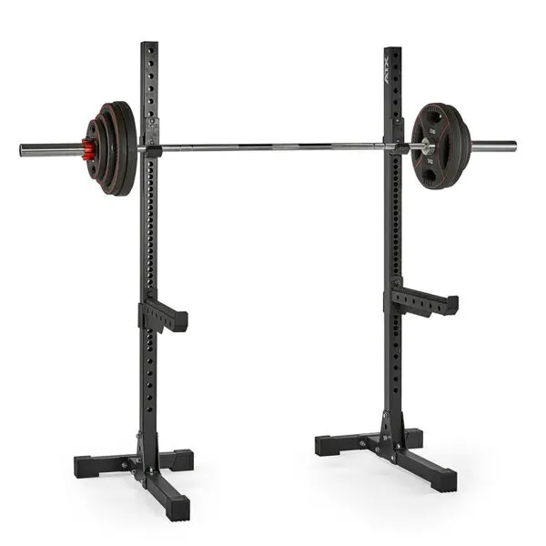 The ATX® Squat Stands 650 SD are crafted from durable black metal, featuring adjustable height and two supportive arms for stability, designed to hold a barbell loaded with weight plates on both sides.