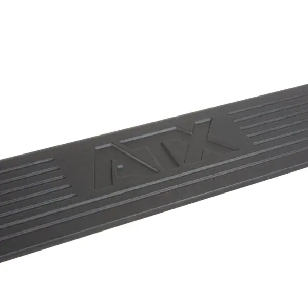 Close-up of a black barbell with the logo ATX embossed in the center, perfectly complementing your squat wedge block. The surface has grooves on each side of the logo.