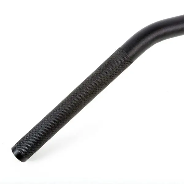 A close-up of a black knurled grip on the Power Maxx 4ft Olympic Barbell, designed for exercise equipment. The metal bar features a textured pattern for improved grip and is set against a plain white background.
