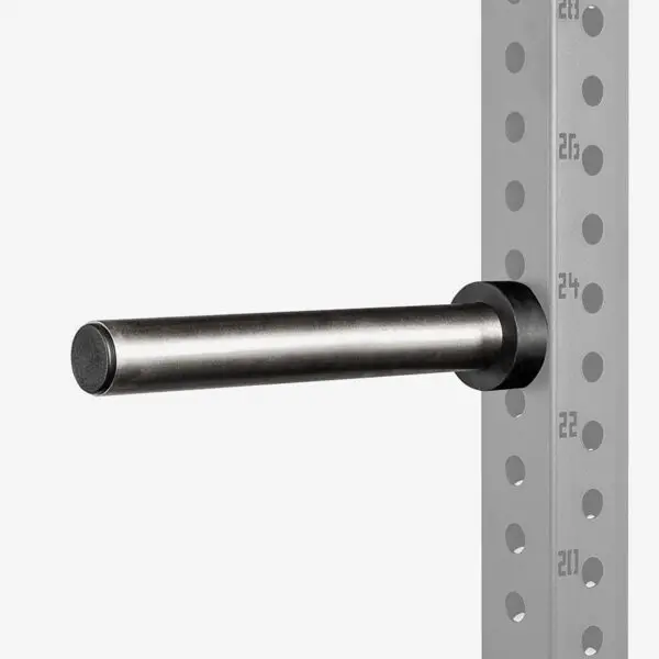 A metal rod fixed to the side of a perforated metal rack, likely an ATX® Weight Plate Pin. The rack has numbered markings on the side for adjusting different height levels.