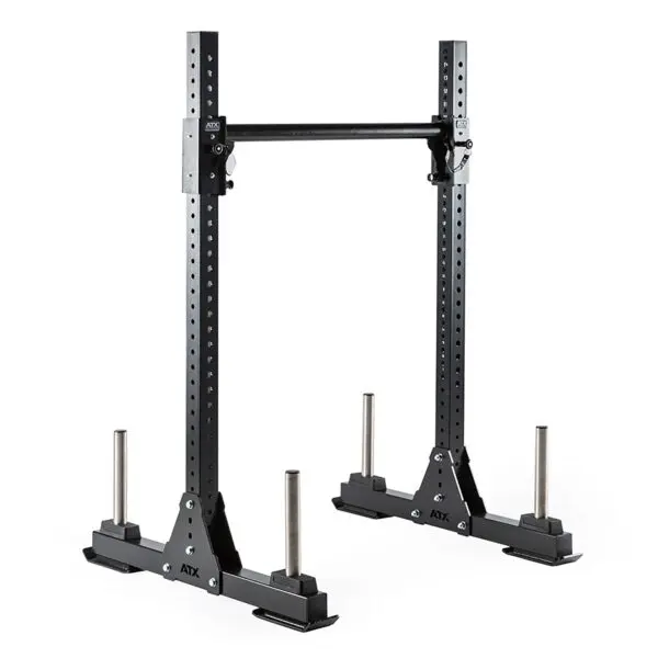 The black ATX® Bulls Strongman Yoke, now discontinued, is a heavy-duty gym squat rack with adjustable hooks and safety bars. It features four weight storage rods at the base, making this freestanding rack minimal yet solid for home or commercial use.