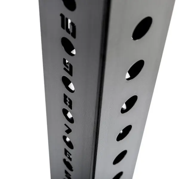 Close-up of the ATX® Bulls Strongman Yoke DISCONTINUED, showcasing a vertical metallic pole with evenly spaced circular holes, shadows, and etched numbers, suggesting structural support or modular design.