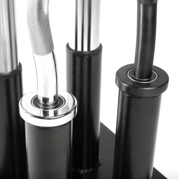 Close-up of a set of sleek, shiny metal barbell handles housed in an Olympic Barbell Holder with black cylindrical slots. The handles vary in texture, featuring both smooth and textured surfaces.