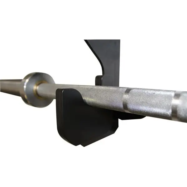 Close-up view of a barbell on the Barbell Gun Rack - Wall Mounted. The knurled grip rests securely in the support groove of the black metal rack.