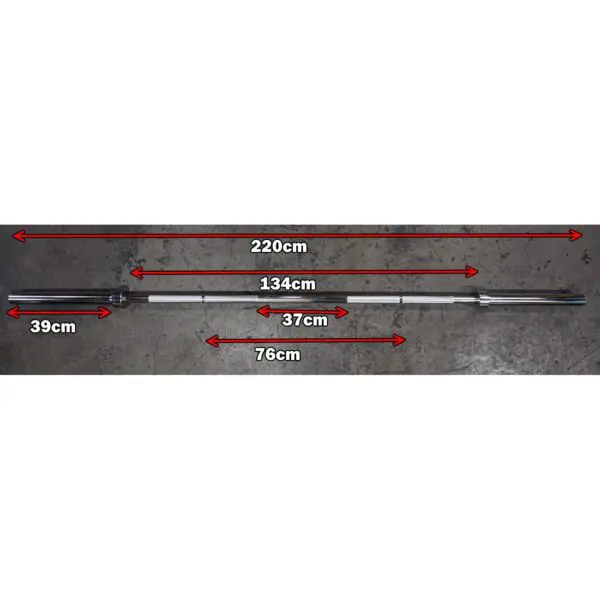 Image of a 7ft 1500lbs Olympic Bushing Bar with marked measurements: total length 220 cm, weightlifting section 134 cm, handle section 39 cm, grip width 37 cm, on concrete flooring.