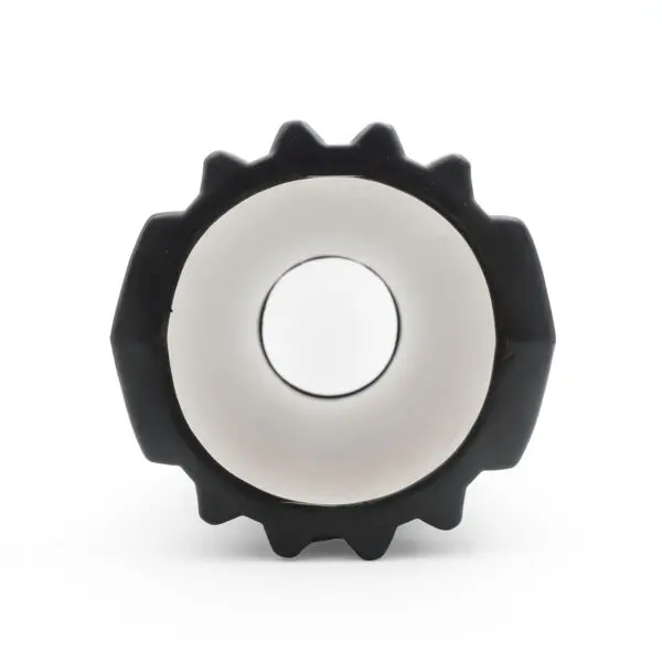 The image features a Power Maxx EVA Foam Roller, black and gear-shaped, with a white circular interior, set against a plain white background.