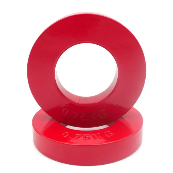 Two red plates from the Power Maxx Olympic 5kg Fractional Plate Set, each weighing 0.75 KG, are displayed: one upright with its hole visible and the other lying flat beneath.