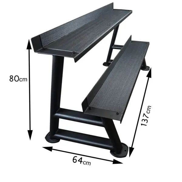 The Power Maxx Kettlebell Rack is a black, two-tier step stand that measures 80 cm in height, 64 cm in width, and 137 cm in length. It features anti-slip surfaces on each step and includes sturdy metal supports for reliable stability.