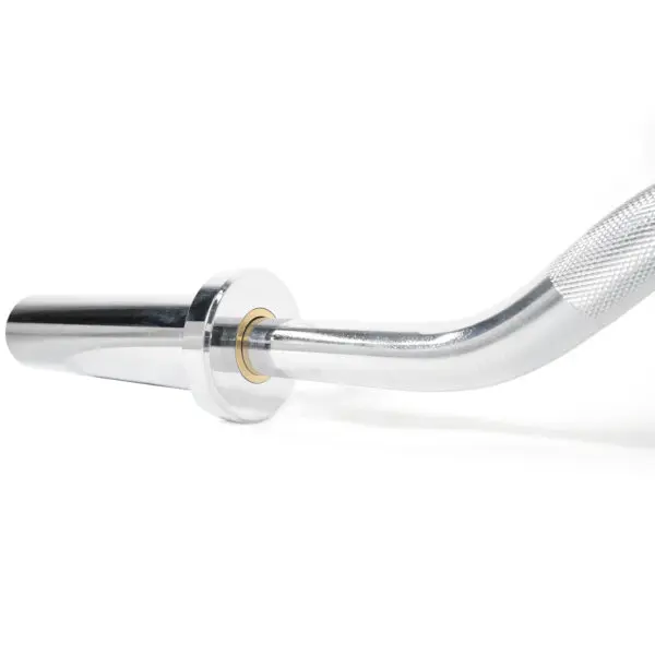 Close-up of a silver Olympic Super Curl Bar sleeve with knurled grip and smooth curves. A gold-colored ring at the connection point adds a sleek, modern touch against a plain white background.