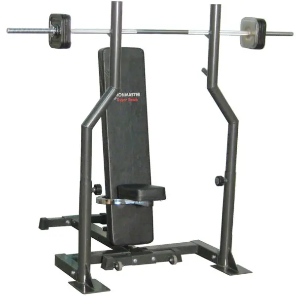 The Ironmaster Barbell Attachment is a black and silver home gym bench press with a padded seat and backrest, featuring a barbell with weights. This equipment stands on a flat base, ideal for strength training exercises.