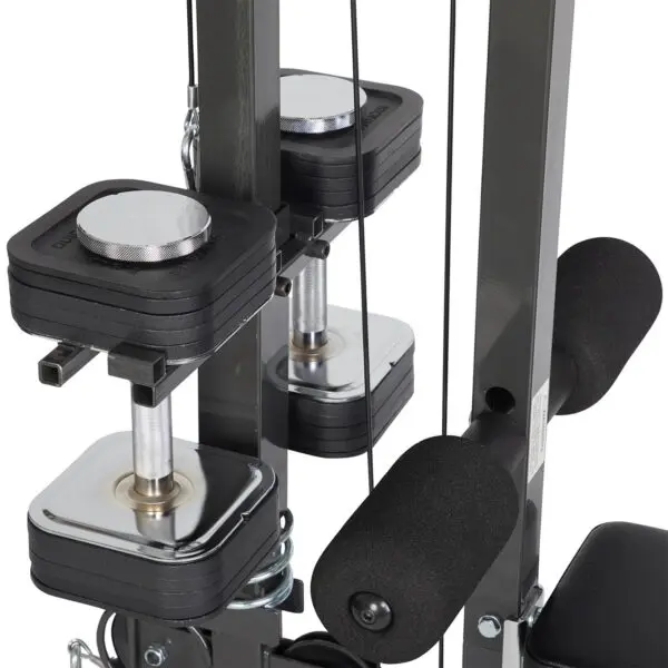 Close-up of the Ironmaster Cable Tower Attachment V2, featuring shiny metal weight stacks, foam-covered handles, and cable attachments on a sturdy metallic structure for strength training.