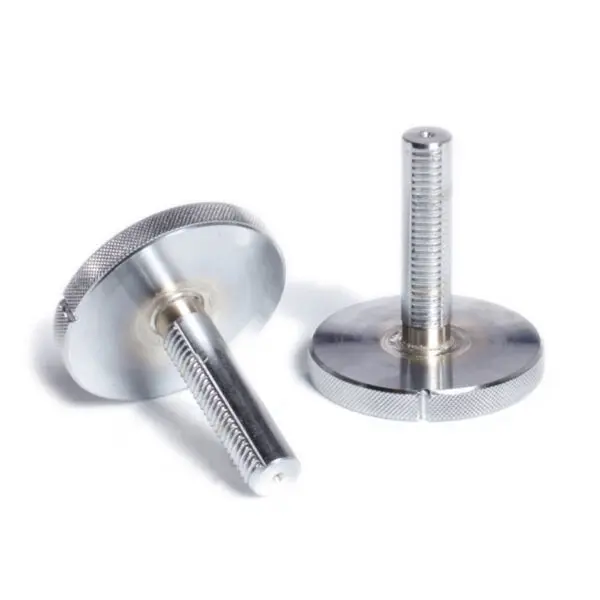 Two Ironmaster Quick Lock Dumbbell Handles are shown. One is upright, revealing the threaded shaft, and the other lies flat, showcasing its circular head. The textured edges stand out against a plain white background.