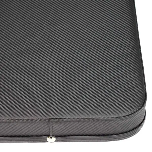 Close-up of a textured black laptop sleeve with a carbon fiber pattern reminiscent of the sleek design found in the Ironmaster Hybrid Bench Pad. The sleeves corner showcases a smooth zipper line with small metallic accents.