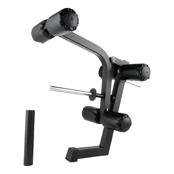 The Ironmaster Leg Lift PRO is a black gym leg extension and curl machine with padded rollers and a metal frame, showcased at an angle to emphasize its sturdy construction and adjustable features. A nearby vertical attachment completes the setup.