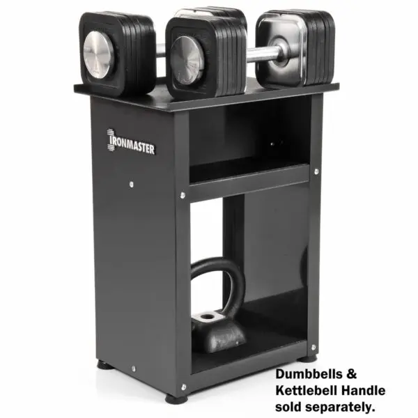 The Ironmaster Quick Lock Dumbbell Stand, in sleek black, supports adjustable dumbbells on top and a kettlebell handle in the lower compartment. Text on the image reads, Dumbbells & Kettlebell Handle sold separately.
