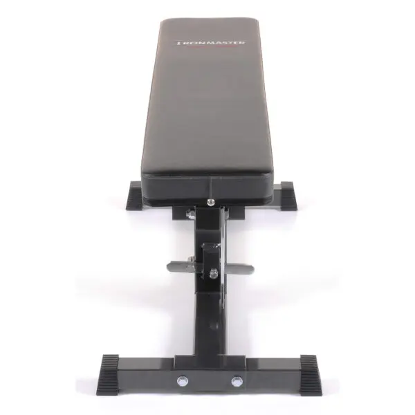 The Ironmaster Super Weights Bench is a black workout bench featuring a padded surface, sturdy metal frame, and rectangular feet for stability. It stands confidently on a white background.