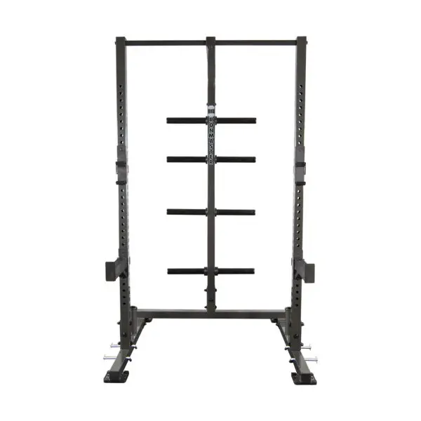 The IM1500 Ironmaster Half Rack is a freestanding squat rack featuring adjustable barbell holders, safety bars, a sturdy metal frame, and multiple weight storage positions on the back.