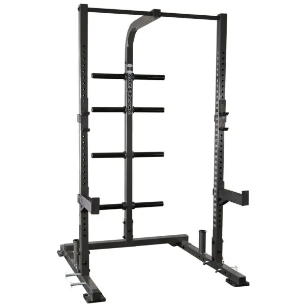 The IM1500 Ironmaster Half Rack is a black power rack featuring adjustable safety bars, multiple weight storage pegs, a top pull-up bar, and adjustable j-cups for barbell support. It is set against a white background.