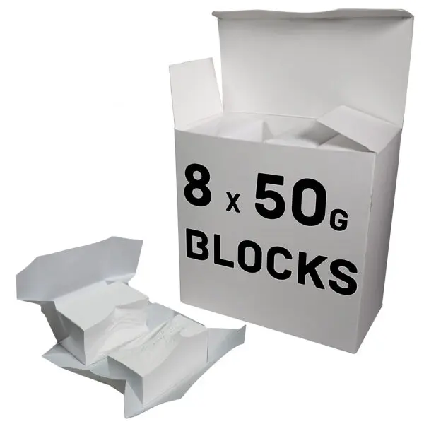 A large white chalk box labeled 8 x 50g Blocks sits with its lid open. Two smaller opened packages reveal white powder blocks perfect for gym chalk use, placed in front of the box.