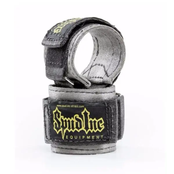 The Spud Choker Wrist Wraps are black and gray lifting straps featuring yellow Spud Inc branding. Coiled with velcro and secured with metal loops, theyre designed for strength training and weightlifting support.