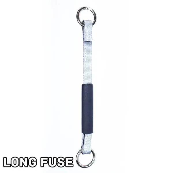 Displayed vertically, the Spud Inc Dynamite Stick Long Fuse features two metal rings at each end and a black rubber grip in the middle. LONG FUSE is written in the bottom left corner against a plain white background.